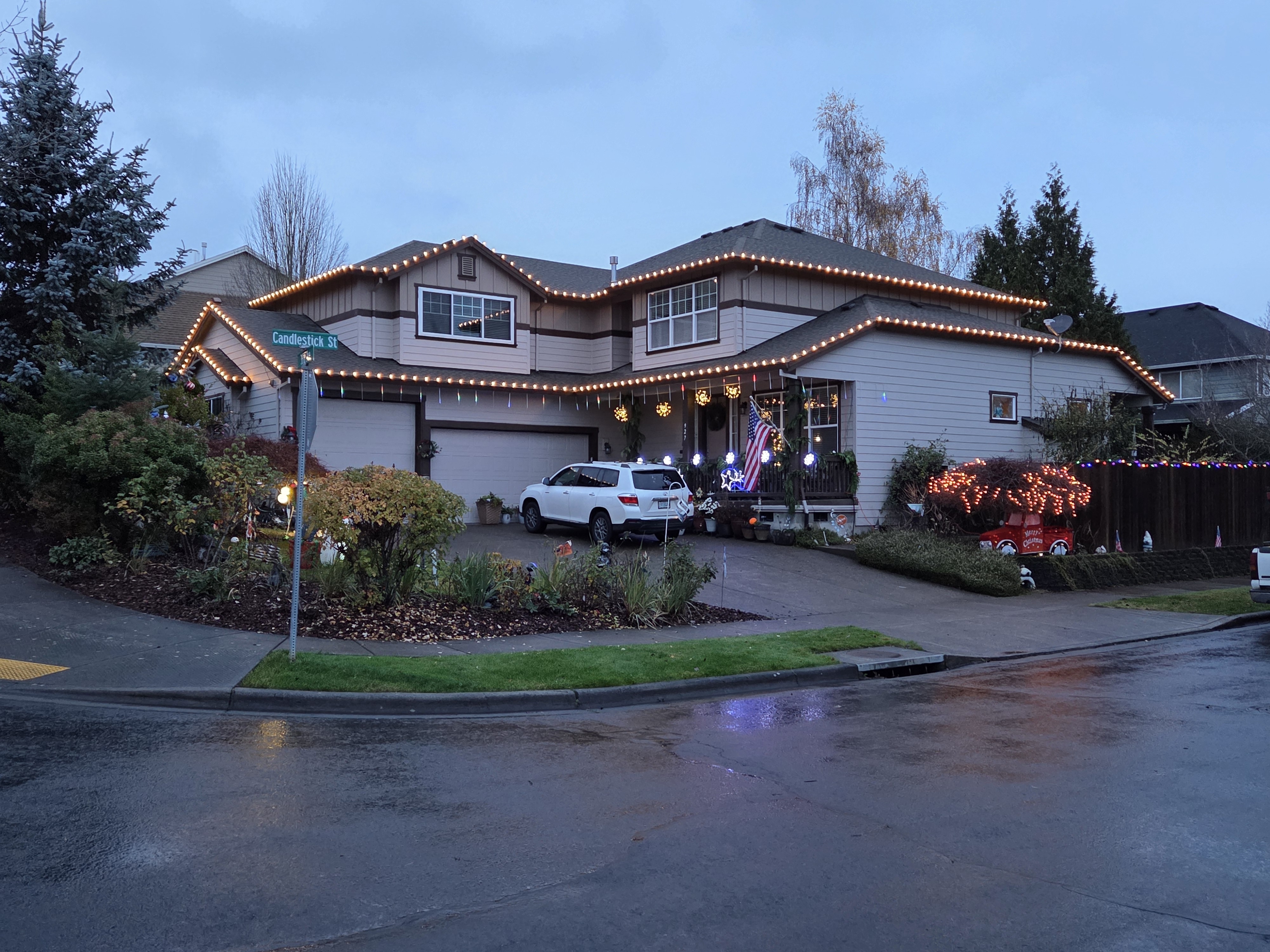 Warm white Christmas roofline lighting at dusk