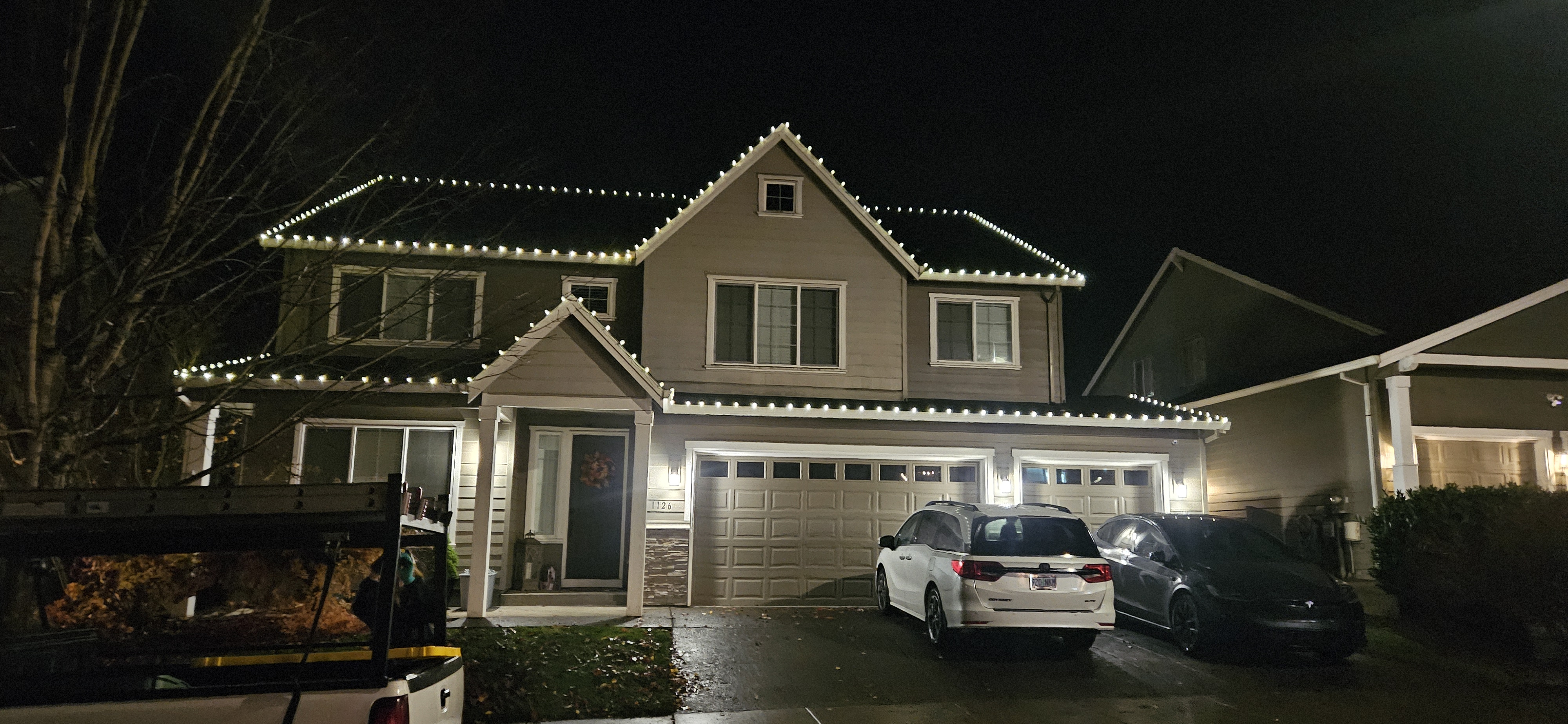 Warm white C9 Christmas lights on a craftsman home