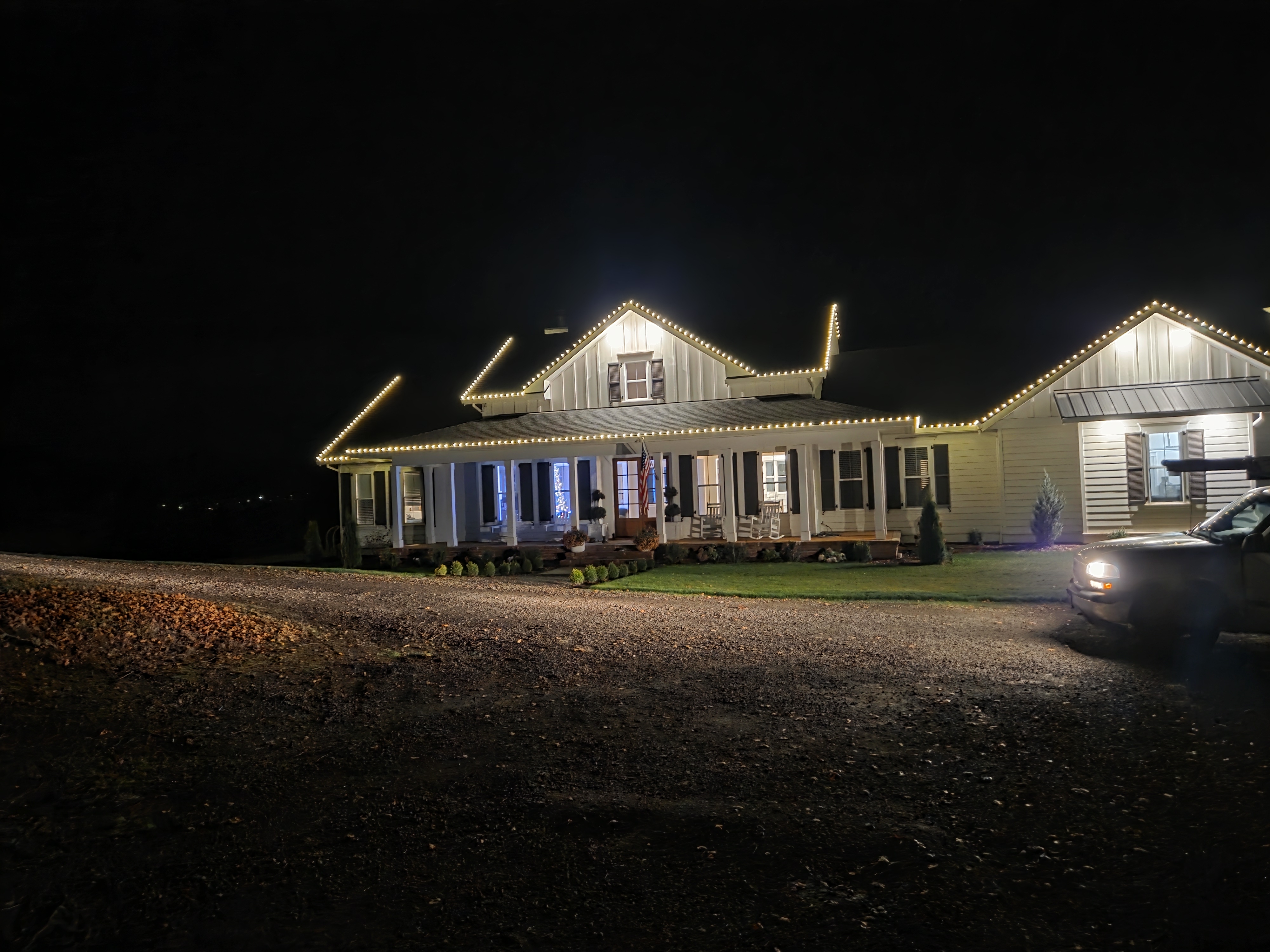 Warm white Christmas lighting on a single-story home