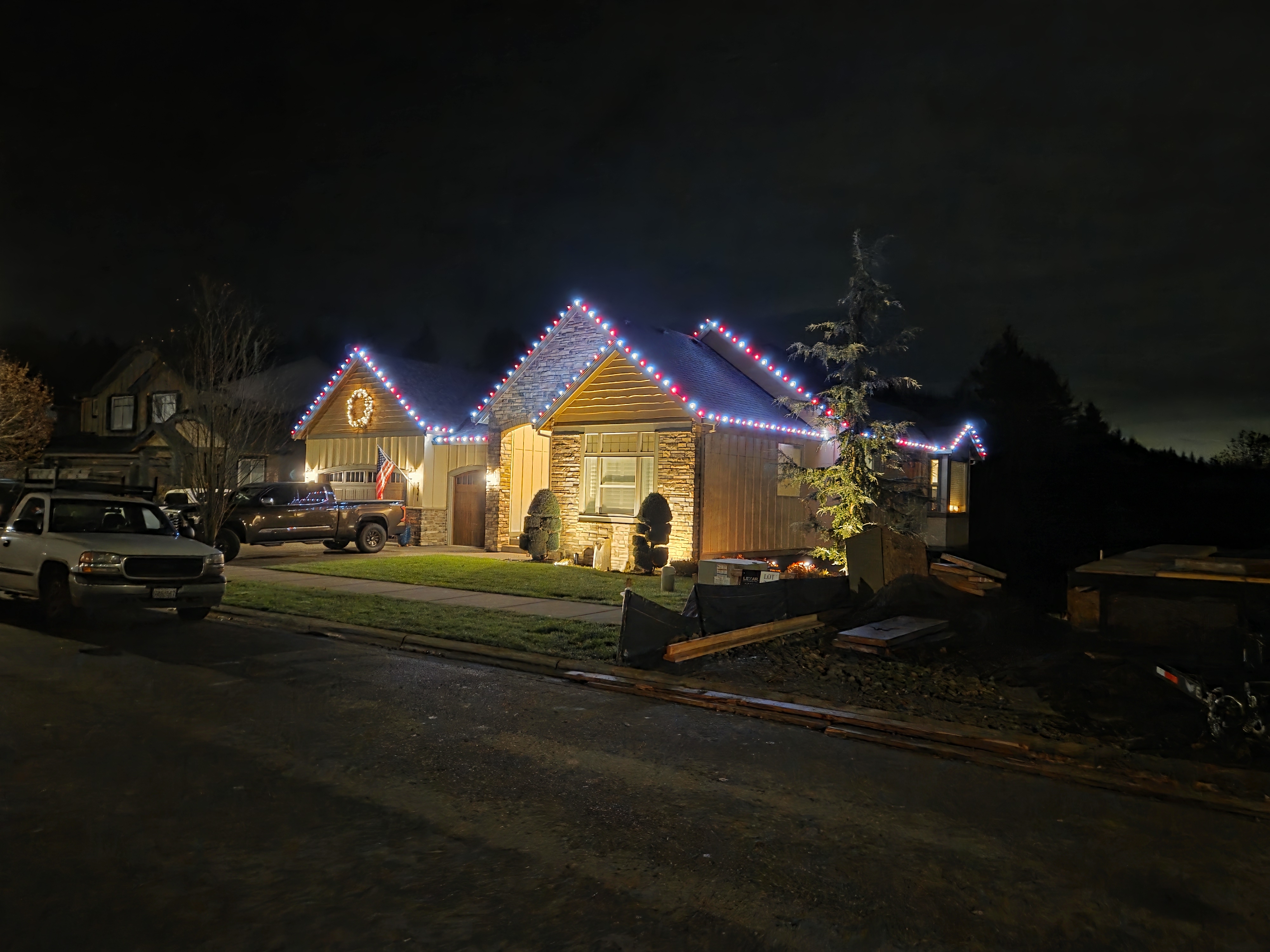 Red and warm white Christmas lights on a home entry
