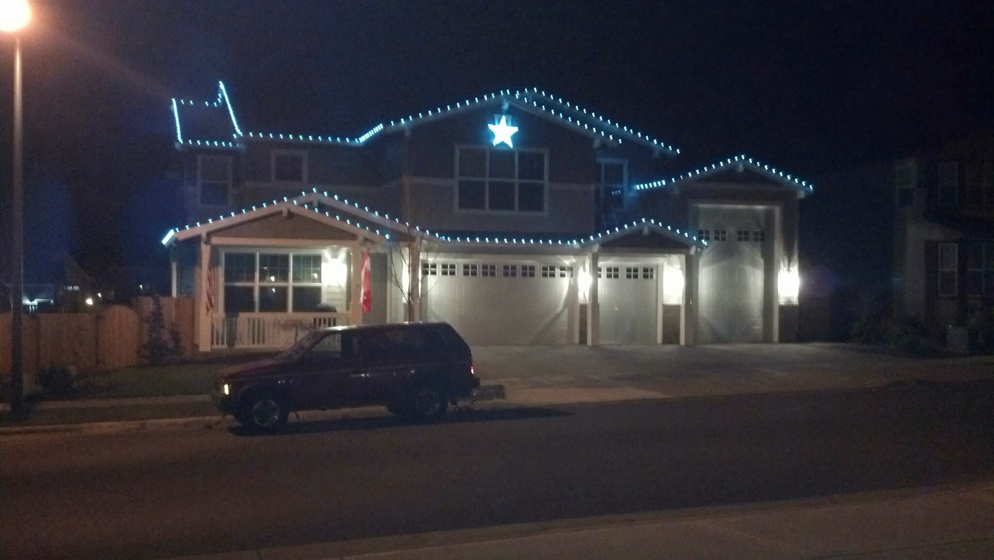 Blue and white lighting on a two-story home