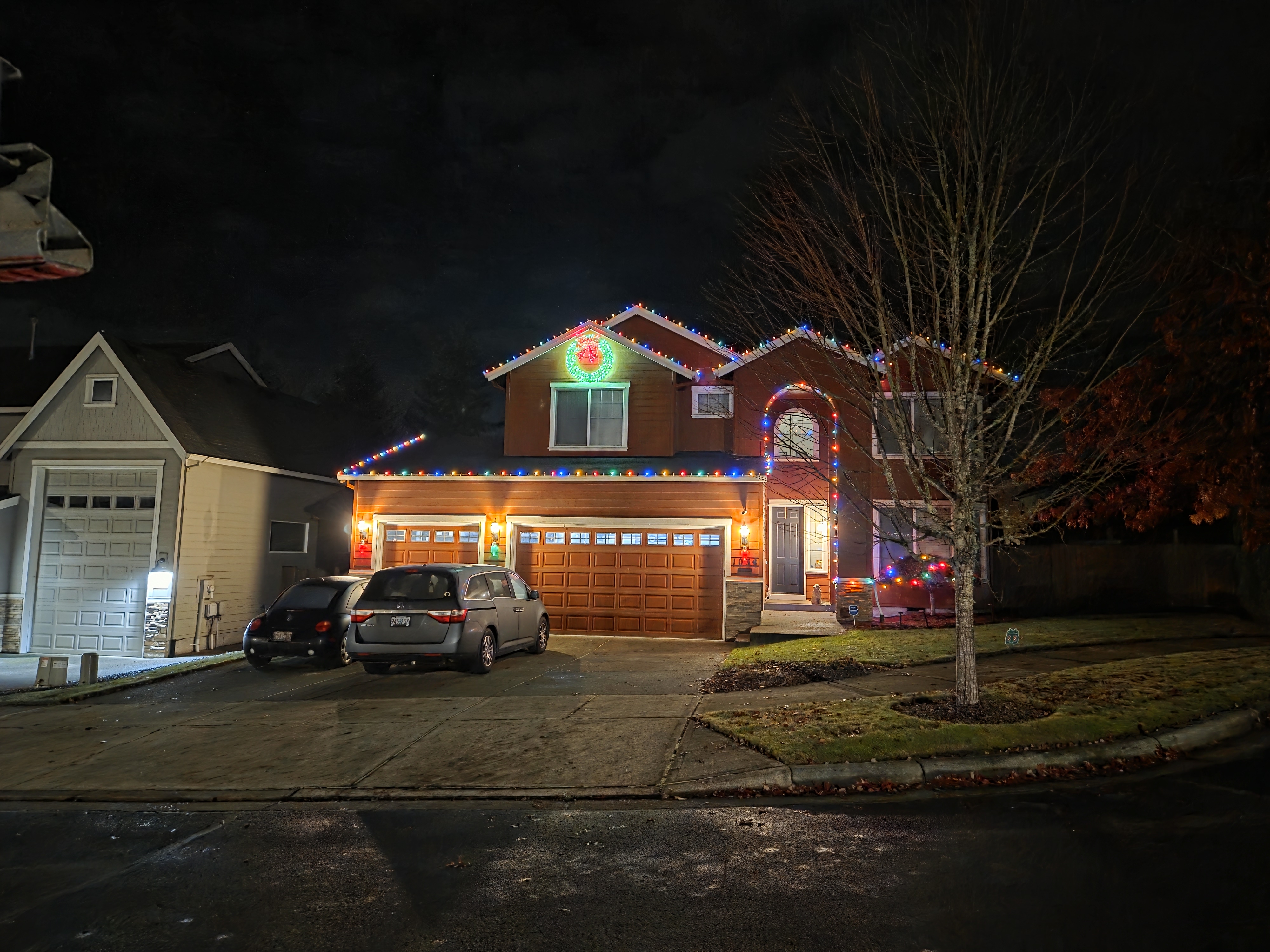 Warm multicolor lighting on a home and garage