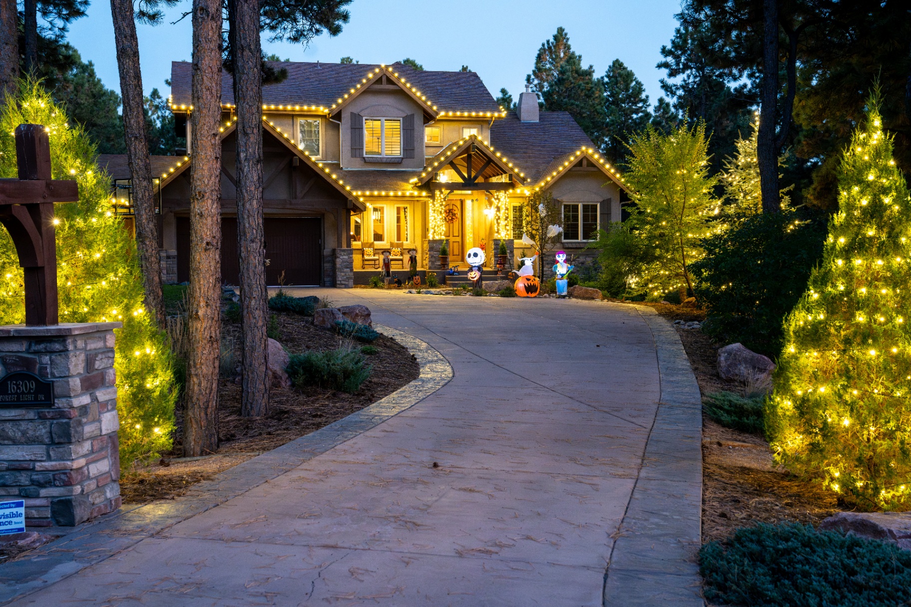Traditional home decorated with classic warm white Christmas lights
